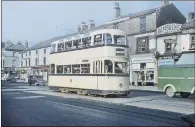  ??  ?? ELECTRIC AVENUES: Above, Sheffield Tramways Company 514 Wilson Road Route pictured in 1959; top, SCT 222 NL in 1960.