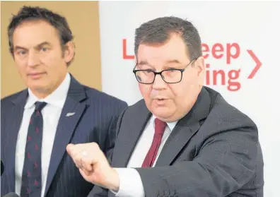  ?? Photo / Mark Mitchell ?? Revenue Minister Stuart Nash (left) and Finance Minister Grant Robertson announcing Labour’s tax policy this week.