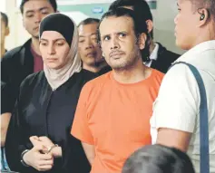  ??  ?? Dhafiri (second, right) and Zina (left) are presented at a press conference at the National Bureau of Investigat­ion (NBI) in Manila.