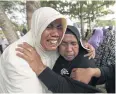  ?? EPA ?? Survivors cry during a ceremony for the 2004 tsunami victims.