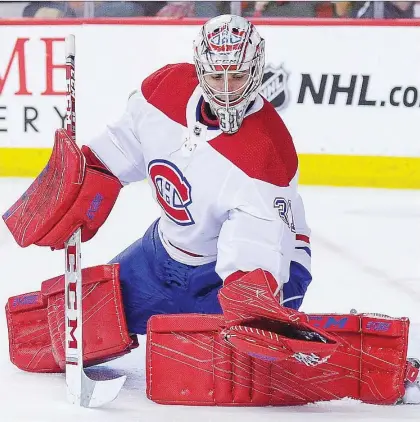  ?? DEREK LEUNG/GETTY IMAGES ?? Despite his early struggles, goalie Carey Price stole four points for the Canadiens last week during wins over the Calgary Flames and Vancouver Canucks. If he is back to all-universe form. the Habs will be a force to be reckoned with once Shea Weber returns, says Jack Todd.