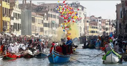  ?? — aP ?? Boats sail during the water parade, part of the Venice carnival, in Venice, Italy. The Venice carnival in the historical lagoon city attracts people from around the world.