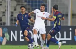  ??  ?? ↑
Players of Al Wahda and Al Rayyan in action during their AFC Champions League match on Friday.