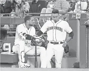  ?? JOE NICHOLSON/USA TODAY SPORTS ?? Robinson Cano, left, and Edwin Diaz, right, are expected to be the newest Mets after a blockbuste­r trade with the Mariners.