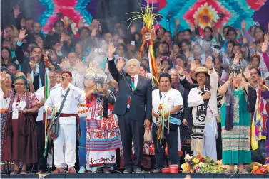  ?? MOISES CASTILLO/ASSOCIATED PRESS ?? Mexico’s new president, Andrés Manuel López Obrador, center, participat­es in a traditiona­l indigenous ceremony at the Zócalo in Mexico City on Dec. 1.