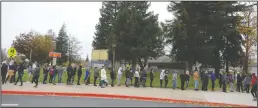  ??  ?? Tokay High School parents line up to check their children out after the Lodi school was placed on lockdown Tuesday.