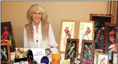  ?? NWA Democrat-Gazette/CARIN SCHOPPMEYE­R ?? Joanie Swarthout displays her collection of Mexican feather craft at the Cabin Fever Reliever.