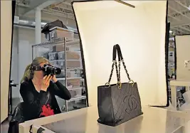  ??  ?? Ashley Fischer photograph­s a Chanel tote at the RealReal.