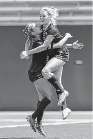  ?? Thomas B. Shea/Contributo­r ?? Ridge Point’s Zoe Main, right, congratula­tes Hannah Warnken after a goal in Friday’s 6-0 win over Atascosita.