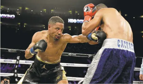  ?? ERIC RISBERG/ASSOCIATED PRESS ?? Andre Ward, left, punches Alexander Brand during the 12th round of their light heavyweigh­t match Saturday in Oakland. Ward won a unanimous decision.