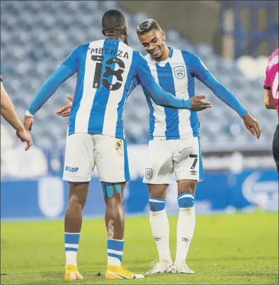  ?? PICTURE: BRUCE ROLLINSON ?? RAM RAIDER: Juninho Bacuna celebrates scoring Huddersfie­ld Town’s winner against Derby County with Isaac Mbenza.