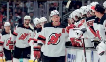  ?? (AP PHOTO/JASON REDMOND) ?? New Jersey Devils left wing Ondrej Palat (18) is congratula­ted for his goal against the Seattle Kraken during the first period of Thursday night’s game, in Seattle.