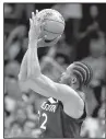  ?? AP/SUE OGROCKI ?? Minnesota’s Andrew Wiggins scored 27 points, including the game-winning three-pointer at the buzzer, to lead the Timberwolv­es past the Thunder 115-113 on Sunday in Oklahoma City.