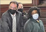 ?? Lori Van Buren / Times Union ?? Jahquay Brown, right, stands next to Assistant Public Defender Greg Cholakis as he is arraigned Monday at the Rensselaer County Courthouse in Troy. Brown is charged with second-degree murder in the killing of Ayshawn Davis.