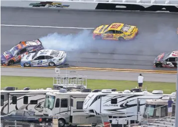  ?? JOHN DAVID MERCER, USA TODAY SPORTS ?? Brad Keselowski ( 2) crashes into then- leader Denny Hamlin ( 11) on the final lap of the Clash at Daytona Internatio­nal Speedway on Sunday.