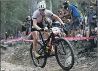  ??  ?? FINEST HOUR: Annie Last riding towards a gold medal in the women’s mountain bike cross-country at the Commonweal­th Games.