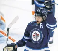  ?? CP PHOTO ?? Winnipeg Jets’ Mark Scheifele celebrates scoring the game tying goal against Philadelph­ia Flyers goaltender Brian Elliott during third period NHL action in Winnipeg on Nov. 16.