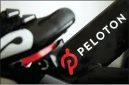  ?? JEFF CHIU — THE ASSOCIATED PRESS FILE ?? Peloton’s logo on one of its exercise bikes. The company’s loss widened in its fiscal third quarter and sales continued to slow as the company contends with a further cooling of the exercise-at-home trend. Shares fell sharply Tuesday.