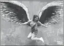  ?? Courtesy photo ?? Gracie Muehlberge­r is captured in midair in front of artist Colette Miller’s angel wings in Los Angeles.