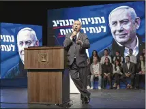  ?? DAN BALILTY / NEW YORK TIMES ?? Israeli Prime Minister Benjamin Netanyahu, speaking at a campaign rally in Ramat Gan, Israel, on Saturday, is Israel’s longest-serving prime minister, seeking a fifth term. Exit polls from the election Monday predicted an incomplete victory.