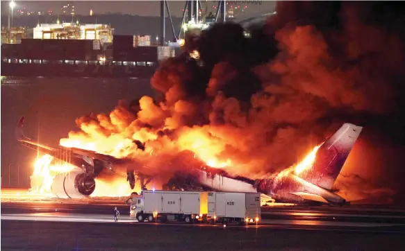  ?? EPA ?? The Japan Airlines Airbus A350 is engulfed in flames on the tarmac at Haneda Airport in Tokyo yesterday. All 379 people on board managed to escape