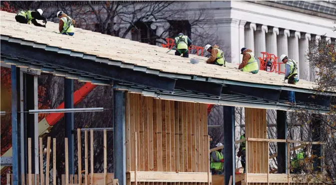  ??  ?? WASHINGTON: Constructi­on continues on the presidenti­al reviewing stand on Pennsylvan­ia Avenue in front of the White House, Saturday, Nov 26, 2016. —AP