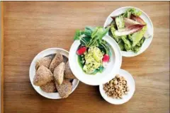  ?? BOBO OHLSSON VIA THE NEW YORK TIMES ?? In a handout photo, snacks served before a meal at Rutabaga in Stockholm. Chef Mathias Dahlgren continues to rely on what’s regional and seasonal at Rutabaga.