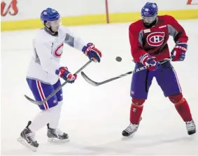  ?? JOHN KENNEY/ THE GAZETTE ?? P.K. Subban, right, and Greg Pateryn battle for a puck at practice on Friday.