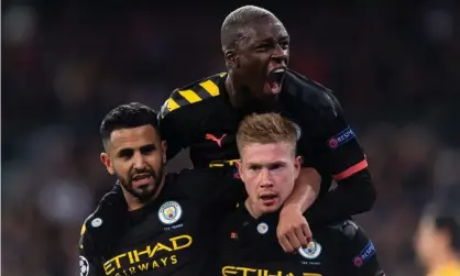  ??  ?? Kevin De Bruyne (right) is embraced by Riyad Mahrez and Benjamin Mendy after scoring during Manchester City’s first-leg win at Real Madrid. Photograph: DeFodi Images/Getty Images