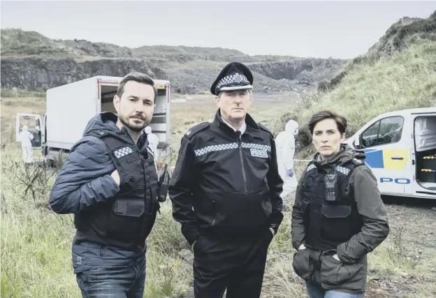  ??  ?? 0 Martin Compston with Hastings (played by Adrian Dunbar) and Kate (Vicky Mcclure) in Line of Duty. Below, getting ready for Soccer Aid