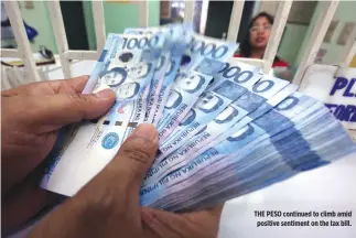  ??  ?? THE PESO continued to climb amid positive sentiment on the tax bill.