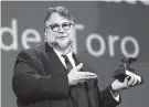  ?? THE ASSOCIATED PRESS ?? Guillermo del Toro holds the Golden Lion for best film for “The Shape Of Water” during the Saturday award ceremony at the 74th Venice Film Festival.