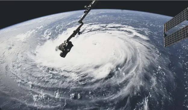  ?? PICTURE: AFP/GETTY IMAGES ?? 0 Hurricane Florence heads for the US coast, as seen from the internatio­nal space station. Widespread flooding and destructio­n is expected