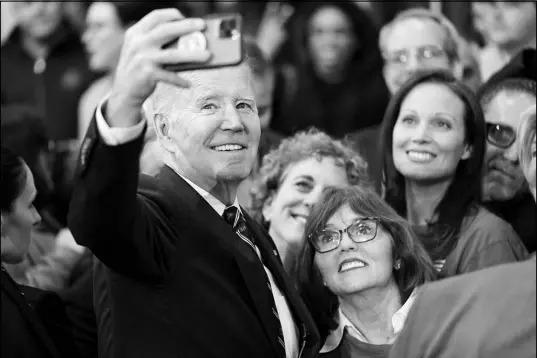  ?? EVAN VUCCI / AP ?? President Joe Biden takes a photo with supporters Thursday after speaking about his 2024 budget proposal at the Finishing Trades Institute in Philadelph­ia.