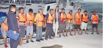  ??  ?? The rescued crew members of MV Lady Joanna II after arrival at the MMEA jetty in Sandakan.