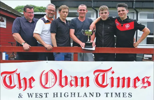  ?? Photograph: Kevin McGlynn ?? Rotary president Tommy McQuade, left, and Oban Times group operations director Keith McIntyre, second left, congratula­te Oban Camanachd C.