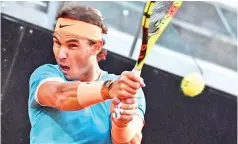  ?? — AFP photo ?? Spain's Rafael Nadal returns a ball to France's Jeremy Chardy during their ATP Masters tournament tennis match.