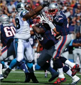  ?? JEFF SINER, CHARLOTTE OBSERVER ?? Carolina Panthers defensive tackle Star Lotulelei rushes New England Patriots quarterbac­k Tom Brady, right, in the first quarter of their game Sunday in Foxboro, Mass.