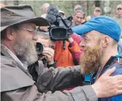  ?? MICHAEL DOYLE ?? Race director Gary Cantrell and runner Gary Robbins at the 60-hour Barkley Marathons in Wartburg, Tenn.