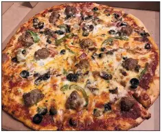  ?? Arkansas Democrat-Gazette/JENNIFER CHRISTMAN ?? Pizzas, such as the Cocina Supreme, are new to the Vesuvio Bistro menu.