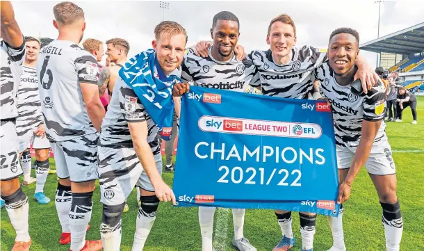  ?? ?? ON THE UP: Regan Hendry, second right, with team-mates Ben Stevenson, Sadou Diallo and Kane Wilson celebrate Forest Green Rovers’ promotion