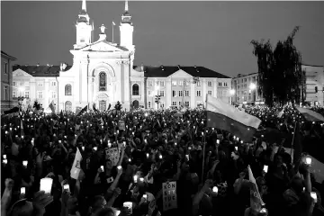  ?? — Reuters photo ?? People gather in front of the Supreme Court during a protest against the Supreme Court legislatio­n in Warsaw, Poland.