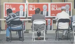  ?? RICK MADONIK TORONTO STAR ?? Supporters of Liberal candidate Bill Blair wait in the parking lot outside his re-election office in Scarboroug­h Southwest as results trickled in Monday.