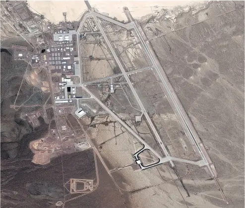  ?? DIGITALGLO­BE VIA GETTY IMAGES ?? A DigitalGlo­be satellite image of a runway in Area 51. The top secret United States Air Force facility commonly known as Area 51 is a remote detachment of Edwards Air Force Base, within the Nevada Test and Training Range.