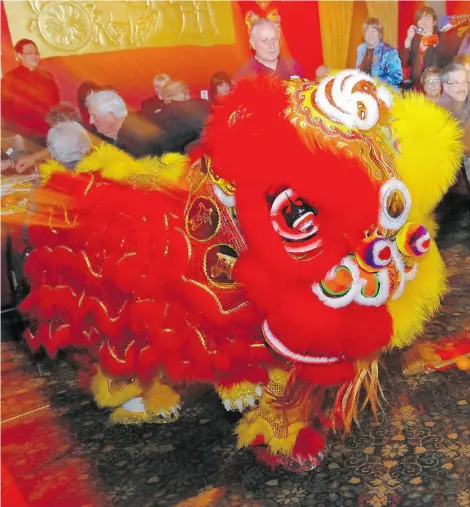  ?? Photos: SHAUGHN BUTTS
/EDMONTO N JOURNAL ?? The lion dance, performed by the Hong De Athletic Associatio­n, is part of the celebratio­n for Chinese New Year at The Lingnan.