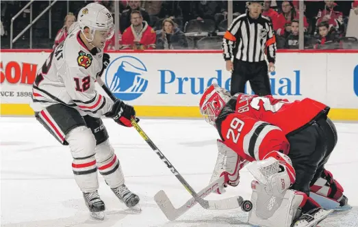  ?? ELSA/GETTY IMAGES ?? Alex DeBrincat, stopped by Devils goalie Mackenzie Blackwood in the shootout, had the lone goal for the Hawks in regulation.