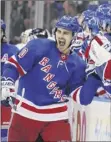  ?? Bruce Bennett / Getty Images ?? Chris Kreider celebrates his power-play goal late in the third period, which helped clinch it for the Rangers.