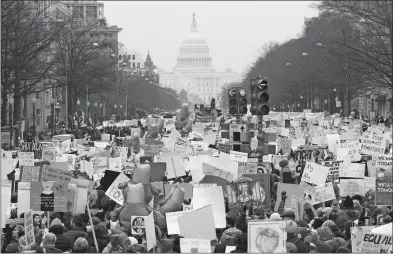  ?? JOSE LUIS MAGANA AP PHOTO ?? Demonstrat­ors march on Pennsylvan­ia Ave. during the Women’s March in Washington on Saturday.