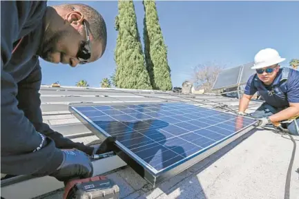  ?? IRFAN KHAN LOS ANGELES TIMES FILE ?? State officials on Thursday voted to allow an exemption to the requiremen­t of rooftop solar panels on new homes in Sacramento.