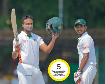  ?? AP ?? Shakib Al Hasan celebrates his century as Mosaddek Hossain watches on day three of the second Test in Colombo. —